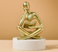 Sculpture abstraite moderne en résine Art Déco, représentant une figure humaine assise tenant un livre, pour la décoration de la maison