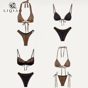 مجموعة ملابس سباحة من قطعتين بتصميم هالتر بلونين (أسود ونمر) مع حمالة صدر مبطنة - Product Image 1