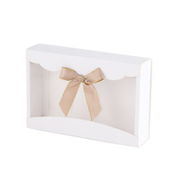 Boîte d'emballage personnalisée auto-élevante pliable en carton ivoire pour serviettes, cravates, sous-vêtements, chaussettes, boîte cadeau avec design créatif en nœud