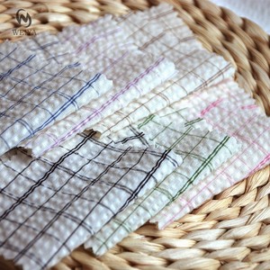 Woven Yarn Dyed Garment <strong>White</strong> Line Grid Plaid CVC Poly <strong>Cotton</strong> Blended Seersucker <strong>Fabric</strong> for Girls Kids Dress Shirt