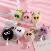 Porte-clés tendance le plus vendu, avec pompon en métal argenté, structure duveteuse, garniture oreille de pêche, breloque œil d'étoile et queue de chat