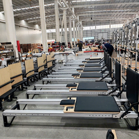 Reformer de Pilates de Aluminio Negro 7075 Grado Aeronáutico Elite con Rieles Completos, Resortes Alemanes, Barra de Pies Infinita y Cama Core Pro