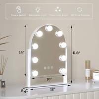 Miroir de maquillage sur pied avec écran tactile personnalisable et design arqué, doté de 9 ampoules LED réglables.