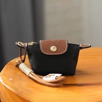 Pochette Dragon Bag Mini Dumpling de l'usine de Guangzhou, créative, bicolore, pour pièces de monnaie, rouge à lèvres et écouteurs, avec petit pendentif portable
