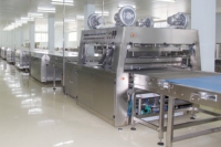 Nouvelle machine d'enrobage au chocolat à bande transporteuse automatique pour usage industriel, traitement des noix, haute productivité