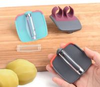 Gadget de cuisine intelligent pour la maison Éplucheur de palme à double doigt en plastique et acier inoxydable pour pommes de terre et légumes
