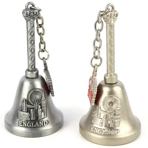 Manufacture customised design zinc alloy tourist souvenir metal craft brass hand dinner bell with charm