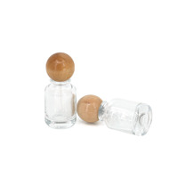 Flacons de parfum vides en verre transparent de 30 ml avec pompe à vaporisation fine ronde, design unique, logo personnalisé, avec couvercle en bois sphérique