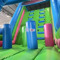 Commerciële herbruikbare all-weather outdoor avontuurpark opblaasbare obstakelbaan met klimwand, glijbaan en tunnelcombinatie