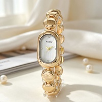 Montre de luxe pour femme, de forme ovale, haut de gamme, écologique, à quartz, avec bracelet perlé et boîtier en alliage de zinc