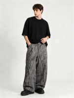 Jean baggy en denim style streetwear américain, respirant, patchwork tissé, coupe légèrement large, délavé, taille mi-haute, boutonné, effet vieilli