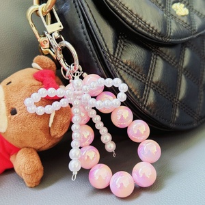 Breloques de téléphone pour filles tendance, avec perles, nœuds et perles de culture, utilisables comme porte-clés, chaîne de téléphone, dragonne ou bracelet. - Product Image 3