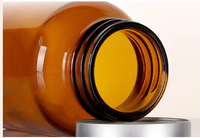 Bouteille de médecine en verre ambré pharmaceutique de 60ml contenant de capsules à large ouverture avec bouchon à vis en aluminium pour perfusion