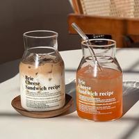 Bouteille en verre borosilicate transparent de 22 oz avec logo personnalisé et lettres imprimées, idéale pour café glacé, lait, jus, eau