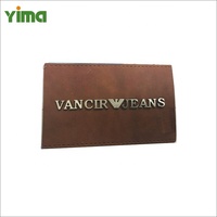 Etiquettes en faux cuir personnalisées de haute qualité et patchs en cuir véritable LOGO OEM pour jeans pour hommes et femmes Denim