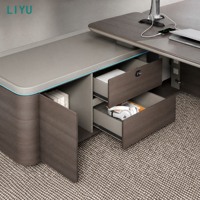 Bureau de direction moderne avec pied trapézoïdal incliné, éclairage LED cyan et armoire latérale pour bureau