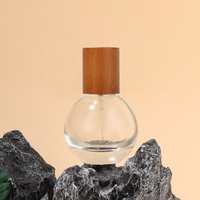 Nouveauté Bouteille de parfum transparente vide Portable ronde 30ml 50ml 80ml Bouteille d'atomiseur de parfum en verre avec emballage