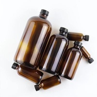 Bouteille d'huile essentielle en verre ambré de grande taille, ronde, de type Boston, avec bouchon à vis noir, disponible en 15 ml, 30 ml, 60 ml, 120 ml, 250 ml et 500 ml.