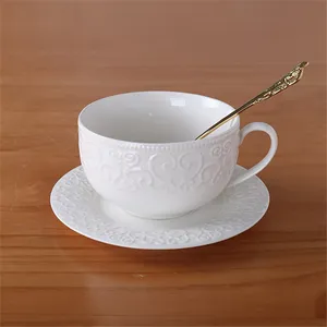 Modern style cheap bulk exquisite emboss white ceramic coffee tea cup and saucer