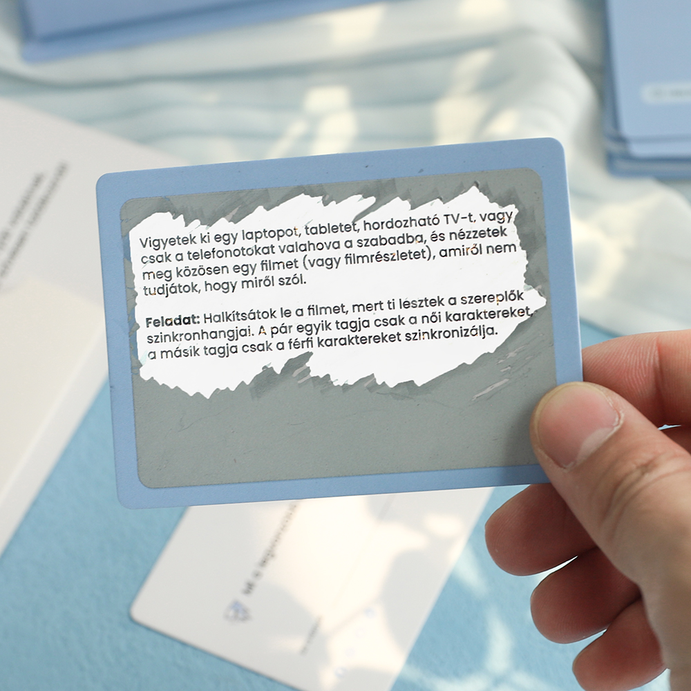 Card with grey scratch coating