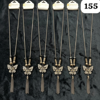 Collier élégant PingBling en alliage de zinc couleur canon de fusil avec pendentif fleur en filigrane orné de strass transparents et de cristaux fumés, avec pompon fluide central