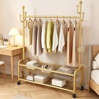 Porte-vêtements de luxe en métal doré avec panier de rangement simple en maille, décoration de chambre, penderie autoportante robuste pour la maison