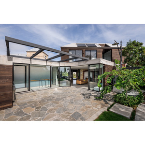 Villa moderna con estructura de acero ligero, residencia privada con paredes de vidrio y patio de piedra, espacio de vida al aire libre. - Product Image 1