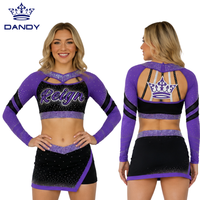 Uniforme de cheerleading personnalisé noir avec strass, haut à manches longues avec inserts en mesh et jupe avec logo de l'équipe royale pour la compétition