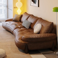 Canapé modulable en cuir Cognac Dune Cloud avec ottoman, pieds en bois capitonnés, accoudoirs rembourrés, mobilier de salon