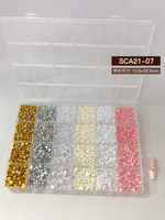 Vente chaude : Kit de 12 compartiments de strass pour ongles en résine, nœuds, perles, cristaux et fleurs pour salon de beauté