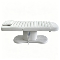 Lit de massage de luxe à 3 moteurs, base en acier inoxydable blanc, pour soins du visage, spa, traitement des cils, pour la beauté et les soins cosmétiques de luxe