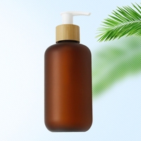 Nouveau modèle de bouteille en plastique PET ambré givré avec logo personnalisé et pompe à lotion en bambou pour l'emballage de lotion corporelle