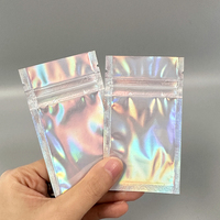 Mini sachet thermoscellable en feuille d'aluminium, sac à trois soudures latérales, mini sac holographique transparent en Mylar avec fermeture éclair