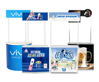 Table promotionnelle pliante portable incurvée personnalisée en PP, d'origine chinoise, pour salons professionnels et supermarchés