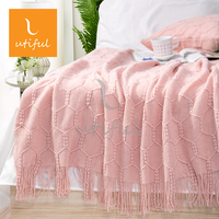 Plaid décoratif 100 % acrylique tricoté chaîne texturé avec pompons, couleur unie douce pour canapé et lit