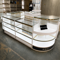 Comptoir de présentation autoportant haut de gamme avec éclairage LED et plateau en verre, base de rangement pour centres commerciaux et salles d'exposition professionnelles