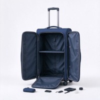 Valise à roulettes souple bleu marine avec deux poches frontales zippées, poignée télescopique et poignée latérale