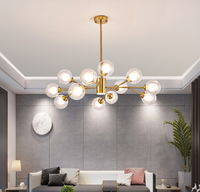 Lustre suspendu moderne nordique avec ampoules dorées et têtes en verre pour la maison