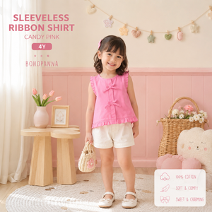 เสื้อเชิ้ตเด็กผู้หญิงแบบไม่มีแขน ตกแต่งด้วยริบบิ้น ผลิตจากผ้าฝ้ายเนื้อนุ่มเพื่อความสบาย ใส่ได้ในลุคสนุกสนานและจัดแต่งทรงง่ายในชีวิตประจำวัน - Product Image 3