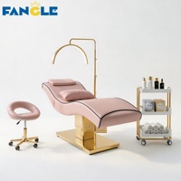 Nouveau style : Ensemble lit de soin et chariot à base dorée, lit SPA vert haut de gamme pour centre de bien-être féminin, table de massage électrique réglable