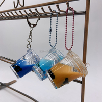 Adorable porte-clés en acrylique transparent rempli d'huile, avec perle flottante pour thé aux bulles, idéal comme souvenir et accessoire de vente au détail