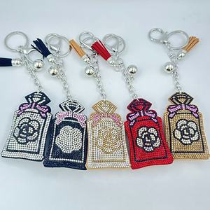 Cute Cartoon Crystal Perfume Bottle Keychains Glitter Rhinestone Encrusted Pendant Leather Tassel Bag Charm Keychain Accessories
