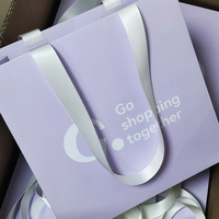 Vente en gros de sacs en papier violet exquis épais avec logo personnalisé pour protection de l'environnement pour robe