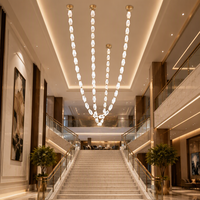 Lustre suspendu LED personnalisé pour hôtel, salon, escalier, longue chaîne en métal et cristal, luminaire de luxe