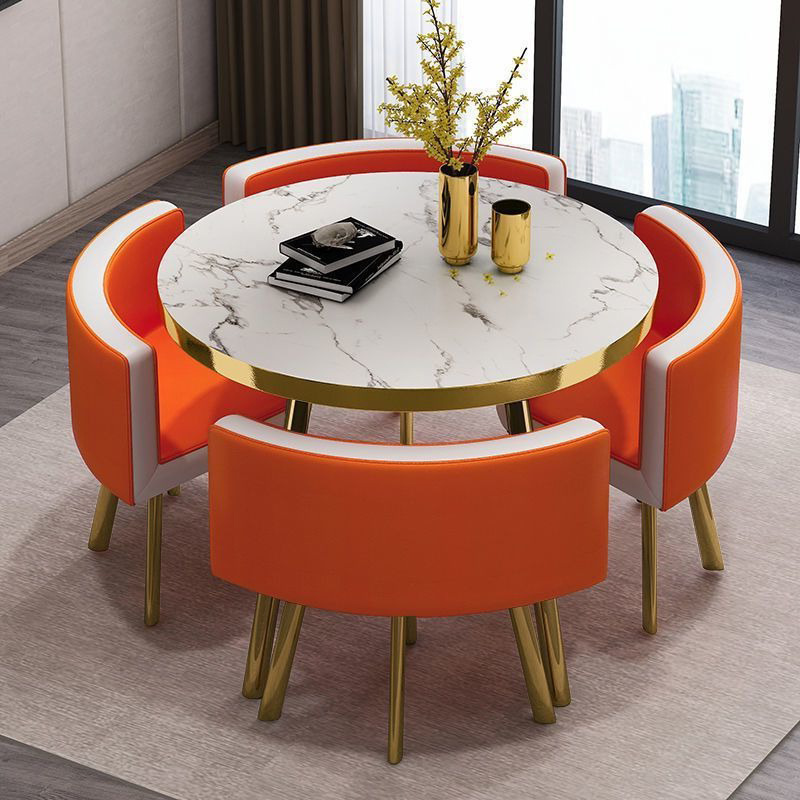 Mesa de piedra de imitación 4 sillas curvadas de cuero blanco naranja