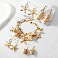 Collier, bracelet et boucles d'oreilles unisexes plaqués or, style bohème chic, avec breloques en forme de coquillage, étoile de mer et conque, pour la vente en gros