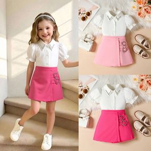 Abbigliamento Estivo Coreano 2026 per Ragazze: Completo Due Pezzi con Camicia Elegante a Maniche Corte a Sbuffo e <span class=keywords><strong>Pantaloncini</strong></span> - Boutique di Abbigliamento per Bambini - Product Image 1