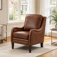 Fauteuil de salon de luxe en cuir véritable avec détails cloutés, dossier haut et accoudoirs incurvés pour la maison et le bureau