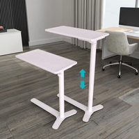 Table basse relevable moderne et écologique à colonne unique avec commande par bouton et roulettes dissimulées, hauteur réglable, plateau rabattable