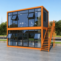 Bureau conteneur à deux étages gris anthracite avec façade vitrée et escalier extérieur pour camping de glamping, salle à manger étanche